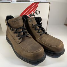 Elevate Your Workwear Game With These Red Wing Chukka Boots. Crafted With High-Quality Leather And A Durable Steel Toe, These Boots Are Perfect For Any Construction Site. The Ankle Shaft Style And Hook & Loop Closure Provide A Comfortable And Secure Fit, While The Leather Outsole Ensures Excellent Traction. These Brown Boots Are Not Only Functional But Also Stylish, With A Classic Chukka Design That Can Be Worn For Any Occasion. The 06662-2 Model Is Available In Uk Shoe Size 10.5, Us Shoe Size 1 Leather Lace-up Work Boots With Protective Feet, Leather Lace-up Work Boots With Foot Protection, Steel Toe Workwear Boots, Ankle-high Work Boots With Reinforced Toe, Workwear Ankle-high Boots With Reinforced Toe, Brown High-top Waterproof Boots For Work, Work Boots With Reinforced Heel And Snip Toe, Brown Lace-up Waterproof Boots For Work, Casual High-top Waterproof Workwear Boots