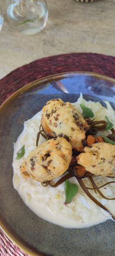 some food is sitting on a blue and white plate