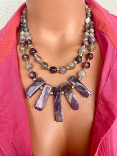 Amethyst and Fluorite Layered Necklace Set This elegant necklace set is a great gift for yourself and your loved ones. Made from natural crystal beads. All metal ornaments are gold plated and won't get darker in time! FREE SHIPPING - All orders get shipped within 1-2 business days. - 5-10 days of delivery time Returns are allowed 14 days after the delivery, however, the cost of delivery lies on the buyer. For more bracelets and necklaces!: https://finecrystalsdesign.etsy.com How to care for your necklace: * Avoid getting moisture, alcohol and perfume, if you do please dry the product with clean cloth. Please take off your necklace before swimming or taking shower. Understanding Dreams, Metal Ornaments, Necklace Purple, Layered Necklace Set, Purple Jewelry, Bracelets And Necklaces, Design Statement, Elegant Necklace, Trendy Necklaces