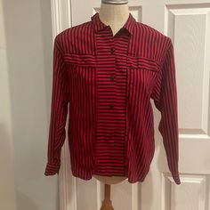 Vintage 1980s Obsessions! Red And Black Long Sleeve Button Down Striped Shirt With Collar 100% Viscose Women’s Size 10 Measures Approximately 19 Inches Armpit To Armpit Length 22 1/2 Inches These Measurements Are Subjective Great Color For Christmas Holidays, Valentine’s Day & Beyond The Vertical Stripes Lend A Slimming Effect Features Shoulder Pads Which Can Easily Be Removed If Desired New Without Tags Smoke Free Business Classic Red Tops With Snap Buttons, Vintage Red Button-up Shirt, Red Snap Button-up Tops, Vintage Red Tops With Button Closure, Vintage Red Top With Button Closure, Retro Red Blouse With Button Closure, Vintage Red Blouse With Button Closure, Red Vintage Blouse With Button Closure, Shirt With Collar