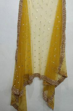 Indian dupatta for women wedding mustard yellow embroidered net. Size: Dupatta is 100 inches (2.5 meter) long and 40 inches (1 meter) wide. Length of this dupatta can be customized as per your requirement. Fabric and work: Sequins embroidered net fabric with lace border. Delivery time: This dupatta will take 3-4 days to produce after we have received your order. While ordered with standard shipping it takes around 2-3 weeks in transit after we dispatch it. You can order with a shipping upgrade, Net Dupatta Designs, Dupatta Designs Ideas, Duppattas Designs Ideas, Kameez Lehenga, Yellow Dupatta, Lehenga Dupatta, Bridal Dupatta, Girls Party Wear, Golden Lace