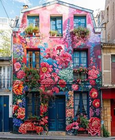 a colorful building with flowers painted on it