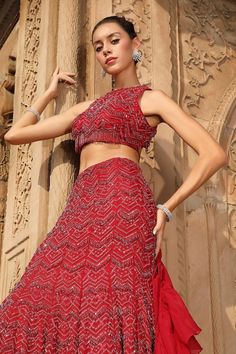 Red attached cancan lehenga with all over chevron embroidery using glass beads, crystals and resham. Paired with a padded blouse with similar work and back cut-out detailing. Comes along with a ruffle dupatta. - Aza Fashions Hand Embellished Red Lehenga For Reception, Red Embellished Party Wear Lehenga, Red Embellished Party Wear Set, Red Embellished Party Wear Choli, Embellished Red Choli For Party Wear, Festive Red Hand Embellished Lehenga, Embellished Red Party Wear Choli, Party Wear Red Choli With Mirror Work, Red Choli With Mirror Work For Party Wear