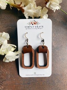 Wood rectangle with leather strap boho earrings.  These earrings are so light weight - you will barely remember you are wearing them!  We use genuine leather/cork in all of our earrings. Our earrings are made to order just for you and we have several shapes/sizes/patterns and dozens of colors so the possibilities are endless!   We use the best quality real leather, cork and wood to bring you trendy and super lightweight boho earrings. Bohemian Brown Rectangular Earrings, Brown Rectangular Bohemian Earrings, Brown Rectangular Earrings With Ear Wire, Trendy Brown Rectangular Jewelry, Minimalist Brown Rectangular Jewelry, Mothers Day Present, Mothers Day Presents, Wood Earrings, Size Pattern