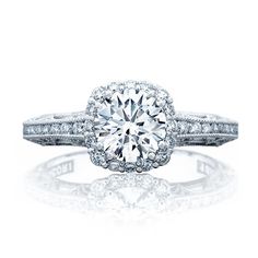 a white gold engagement ring with diamonds on it