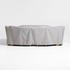 an outdoor furniture cover with wooden legs