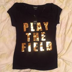 Bebe Black T-Shirt Size: Sp Condition: New With Tag Material: 94% Rayon, 6% Spandex Gold Letter Print Top For Summer, Gold Letter Print Tops For Summer, Gold Short Sleeve Top With Text Print, Trendy Tshirts, Black T Shirt, Black Tshirt, Womens Tops, Spandex, Tags