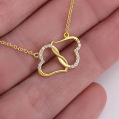 A stunning, infinitely connected pair of 10K solid yellow gold hearts that perfectly symbolizes your Everlasting Love. Each heart is intricately accented with 18 pave set diamonds with a 0.07-carat weight which adds magnificent sparkle.Set inside a Luxurious Mahogany Style Gift Box, featuring a super-bright LED to showcase the beautiful pendant.Necklace Details: Pendant: Solid 10k Gold• 0.5" x 0.6" (12x15mm) • Weight .04 oz (1.2 grams)• 18 Single Cut Diamonds • Carat Weight 0.07ctChain and Clasp Yellow Gold Heart Necklace, Wife Necklace, Gold Hearts, Solid Gold Necklace, Gold Diamond Necklace, Gold Heart Necklace, Anniversary Gifts For Wife, To Infinity And Beyond, Everlasting Love