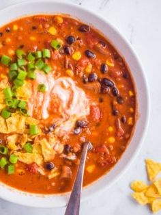 a white bowl filled with chicken tortilla soup