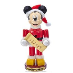 a mickey mouse figurine holding a sign