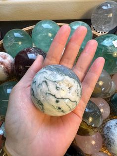 Explore the serene beauty of our Moss Agate Sphere, a captivating piece that brings the essence of nature into your space. Handcrafted and polished to perfection, this sphere highlights the intricate, moss-like inclusions that make each piece truly unique. Key Features: Material: 100% Natural Moss Agate Color: Earthy greens with unique, mossy patterns and clear to milky quartz Finish: Smooth, polished surface Why You'll Love It: Nature's Art: Each Moss Agate Sphere is one-of-a-kind, with beautif Agate Natural Stones Crystals As Gift, Agate Natural Stone Crystal As A Gift, Natural Agate Crystal Stones As Gift, Agate Crystal With Natural Stones For Gift, Meditation Area, Crystal Home Decor, Essential Oils For Skin, Crystals In The Home, Crystal Collection