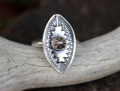 "This sterling silver bohemian concho ring is so funky and fun. Each ring is made to order from raw sterling silver sheet metal using hand-carved Navajo metal dies to forge the shapes into the silver and give it that unique southwestern style. The design is stamped into thick 18 gauge sterling silver sheet and fired onto a sturdy half-round sterling silver band. I then give it a darkened patina and highlight the relief for nice contrasts. Each ring is marked .925 for sterling silver. These are b Bohemian Stamped Silver Rings, Bohemian Silver Stamped Rings, Silver Bohemian Concho Rings, Bohemian Silver Concho Rings, Bohemian Oval Stamped Jewelry, Silver Boho Rings, Rings Sterling Silver, Southwestern Jewelry, Statement Ring Silver