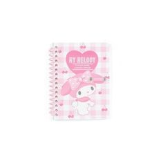 a pink and white notebook with a hello kitty on it