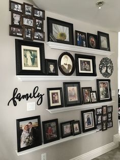 a wall filled with family pictures and framed photos