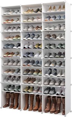 a large white shoe rack filled with lots of pairs of shoes and boots on top of each shelf