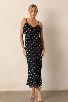 Dance under the moonlight in our Mystic Moon Black Polka Dot Ruffle Maxi Dress. With its playful polka dot pattern and flirty ruffle detail, you're sure to turn heads. The lightweight fabric ensures comfort and easy movement, perfect for any special occasion. Shine bright and stand out in this unique and stylish dress. This black dress features a v-neckline, ruffles throughout, an open leg slit, an self-tie leg ribbon, adjustable spaghetti straps and a flowing silhouette. Under The Moonlight, Mystic Moon, Halter Bridesmaid Dress, Moon Black, Ruffle Maxi Dress, Black Dresses Casual, Holiday Dress, Little White Dresses, Ruffled Maxi Dress