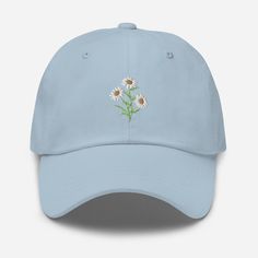 "This floral hat is perfect for spring! * 100% chino cotton twill * Green Camo color is 35% chino cotton twill, 65% polyester * Unstructured, 6-panel, low-profile * 6 embroidered eyelets * 3 ⅛\" (7.6 cm) crown * Adjustable strap with antique buckle * Blank product sourced from Vietnam or Bangladesh" Preppy Hat, Vacation Hat, Celebration Balloons, Hat Flower, Mens Hats Baseball, Hawaiian Hibiscus, Stylish Caps, Hawaiian Vacation, Flower Hat