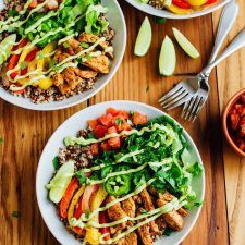 three plates of food on a wooden table