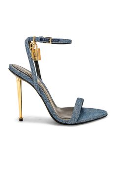 Find TOM FORD Padlock Pointy Naked 105 Sandal In Blue on Editorialist. TOM FORD Padlock Pointy Naked 105 Sandal in Blue Denim fabric upper with leather sole. Made in Italy. Ankle buckle closure. Lock and key charm detail. Pointed toe. Approx 105mm/ 4.1 inch heel. TFOF-WZ75. W2272-TDE010G. About the designer: Tom Ford lends a contemporary elegance to all things sartorial. Raised in Santa Fe, Ford made a name for himself as creative director at Gucci, where he transformed the house of fashion into a thriving 21st century brand before going on to launch his own wildly successful label in 2005. Today, Tom Ford is coveted for everything from its statement sunglasses and fine leather accessories to its glamorous dresses and impeccably tailored suits. A Tom Ford design is an exquisite balance of Tomford Heels, Tom Ford Gold Heels, Denim Tom Ford Heels, Tom Ford Crystal Heels, Luxury Fitted Blue Heels, Designer Blue Pointed Toe Heels, Blue Tom Ford Heels, Tom Ford Heels, Tom Ford Jeans