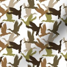 a flock of birds flying across a white sky with brown and green silhouettes on it