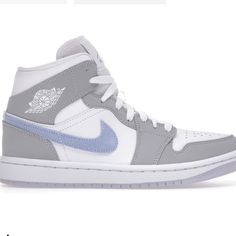 Size Us 7 (Womens) Gray Boost Midsole Sneakers, Jordan 1 Mid Wolf Grey, Jordan 1 Mid Grey, Nike Air Jordan Mid, Clean White Leather, Nike Swoosh Logo, Nike Air Jordan 1 Mid, Mid Top Sneakers, Jordan Sneakers