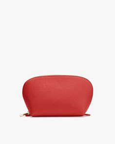 Zippered pouch on a plain background. Modern Red Rectangular Cases, Modern Red Rectangular Case, Classic Soft Leather Pouch For On-the-go, Red Pebbled Leather Bag For Everyday Use, Red Leather Travel Wallets, Classic Red Travel Wallet, Modern Red Travel Cases, Luxury Red Pouch For Everyday Use, Red Bag With Smooth Grain