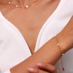 Summer's here! Enjoy the rays and waves with this sweet Pearl Chain Gold Bracelet made with luscious freshwater pearls. Perfect for beach days or nights, this fashionable jewelry will make ya sparkle! Get your glimmer on! DETAILS & SIZE Finish: 18K gold plate Materials: Stainless steel; Freshwater pearls Measurements: Pearls: 6mm; Chain: 6" + 1" extension Lobster claw clasp Waterproof, tarnish resistant, nickel free Shop Bracelets for more options to layer this with! Cascade Necklace, Gold Pearl Jewelry, Pearl Chain Necklace, Gold Pearl Necklace, Freshwater Pearl Bracelet, Choker Style, Gold Plated Bracelets, Bracelets For Women, Stunning Earrings