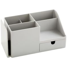 a white desk organizer with four compartments