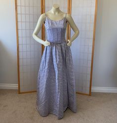 vintage 1980s Jessica McClintock Formal Party Dress Gown. Sleeveless with Spaghetti straps. Corset waist with lace up back. Crinoline skirt underneath. Lavender purple with white/silver stripes. In good vintage condition--it does have one mended small hole and 2 more tiny holes near the hem. Some faint watermarks that should come out with dry cleaning and the corset has seams at the top that should be tightened. overall the dress looks great. Size: Measures a size 0 Extra Small: check measurements:  Will fit: Bust: 30 1/2 inches to 31 1/2 inches  Waist: 24 inches to 25 inches  Length: 56 inches Lavender Corset, Underarm Discoloration, Maxi Formal Dress, Crinoline Skirt, Corset Waist, Formal Party Dress, Jessica Mcclintock, Dress Looks, Gunne Sax