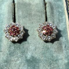 Earrings Size: 11.2 mm Metal Type: 18k gold  Weight: 4.15 grams Diamonds: 1.40 ct. Rubies:0.50 ct. Color: G Clarity: VSI-Si Natural ruby: 0.50 ct. Condition: Excellent Ruby and diamond 18k gold earrings. Featuring natural altogether 0.50 ct. rubies with a raspberry red color, and very bright and clear altogether 1.40 ct. diamonds with G color and VSI-Si clarity. The diamond frame around the rubies is removable so you can wear the earrings with or without it. The earrings weigh 4.15 grams and are Diamond Clip-on Earrings With Brilliant Cut, Round Diamond Clip-on Earrings As Gift, Diamond Clip-on Round Earrings For Gift, Round Diamond Clip-on Earrings For Gifts, Diamond Round Clip-on Earrings For Gift, Diamond Round Clip-on Earrings As Gift, Round Prong Setting Clip-on Earrings For Wedding, White Gold Earrings With Jewels, Red Round Bridal Earrings For Anniversary