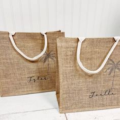 two jute bags with palm trees on them