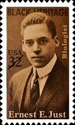 a stamp with an image of a man in a suit and tie on it's front