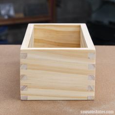 a wooden box sitting on top of a table