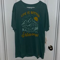 ‘Life Is Better In Wilderness’ Graphic T-Shirt. Nwt, Teal/Yellow Colors. Purchased From The Buckle. Smoke Free Home. Casual T-shirt For Outdoor Spring Activities, Casual T-shirt For Spring Outdoor Activities, Casual T-shirt For Outdoor Spring Events, Casual Green Tops For Outdoor Activities, Yellow Short Sleeve Tops For Outdoor, Casual T-shirt For Outdoor Activities In Spring, Casual Short Sleeve Tops For Outdoor Activities, Green Cotton Top For Outdoor Activities, Spring Relaxed Fit T-shirt For Outdoor Activities