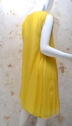 Women's James Galanos 1970s Amelia Gray Summer Yellow Chiffon Dress For Sale Chic Yellow Chiffon Dress, Yellow Chiffon Evening Dress, Elegant Fitted Yellow Chiffon Dress, Yellow Chiffon Cocktail Dress, Elegant Yellow Pleated Mini Dress, Yellow Silk Dress With Ruffles, Yellow Silk Dress For Daywear, Chic Yellow Silk Mini Dress, Yellow Chiffon Dress