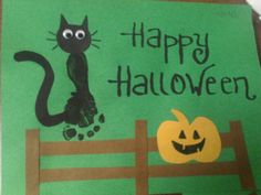 a handmade halloween card with a cat and pumpkin