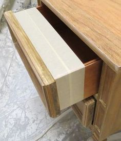 a close up of a wooden desk with drawers