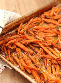 there are carrots that have been cooked in the oven and on toasted bread