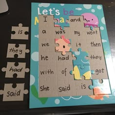 there is a piece of puzzle on the table with words and pictures to put in it