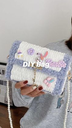 a woman holding a purse with the word diy bag on it and some beads