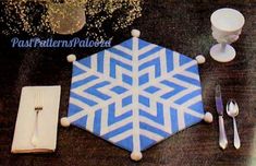 a blue and white table setting with silverware