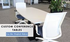 a conference table with two chairs and a potted plant in the background that says, custom conference tables for the perfect office