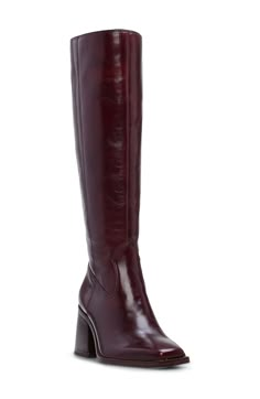 A contemporary square toe and flared block heel balance a versatile boot that will flawlessly complement your polished wardrobe. 2 3/4" heel (size 9) 15 1/2" shaft; 15 1/2" calf circumference Leather upper/synthetic lining and sole Made in Brazil Burgundy Leather Knee High Boots, Flat Burgundy Boots, Chocolate Brown Knee High Boots, Knee High Fall Boots, Square Toe Tall Boots, Knee High Wide Calf Boots, Knee High Red Boots, Red Tall Boots, Red Brown Boots