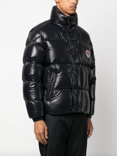 For brand lovers - the Misam short down jacket for men is crafted from iconic nylon laqué and embellished with a heart motif.Brand heritage meets a contemporary aesthetic in the Misam short down jacket from the men's collection. Crafted from iconic nylon laqué, the short puffer comes in a voluminous, oversized silhouette. An embroidered, heart-shaped patch gives a fresh perspective to the classic Moncler logo.Crafted from lightweight nylon laquéLightweightNylon laqué liningDown-filledStand collarZipper and snap button closureZipped welt pocketsInternal pocket with snap button closureElastic cuffsHem with drawstring fasteningEmbroidered logo patchBrand style ID: I20911A00152595GJColour: 999 Heart Motif, Jacket For Men, Trainer Boots, Oversized Silhouette, Shell Jacket, Men's Collection, A Heart, Down Jacket