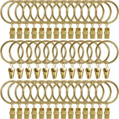 a bunch of gold rings and locks on a white background with clippings for text