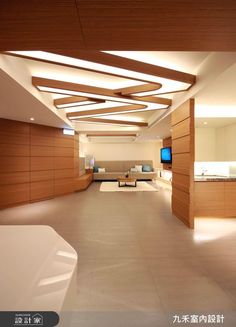 an empty room with wood paneling and white carpeted floors, lighting up the ceiling