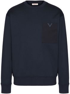 Valentino Ready To Wear midnight blue cotton blend VLogo Signature crew neck long sleeves chest patch pocket straight hem ribbed trim The full look includes Valentino Garavani accessories. Navy Cotton Sweater For Work, Blue Long Sleeve Sweatshirt With Side Pockets, Crew Neck Cotton Sweatshirt With Side Pockets, Blue Sweatshirt With Side Pockets For Fall, Blue Crew Neck Sweater With Pockets, Cotton Sweatshirt With Ribbed Cuffs For Work, Valentino Ready To Wear, Full Look, Mens Activewear