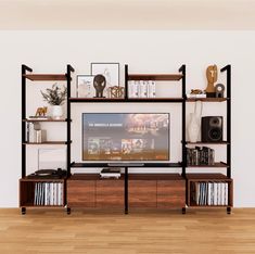 an entertainment center with bookshelves and shelves