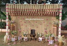 a mandap decorated with flowers and potted plants