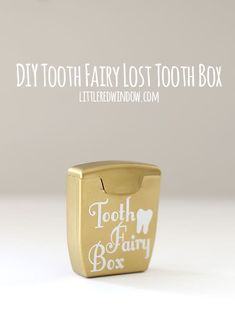 a gold toothbrush holder with the words tooth fairy lost tooth box on it's side